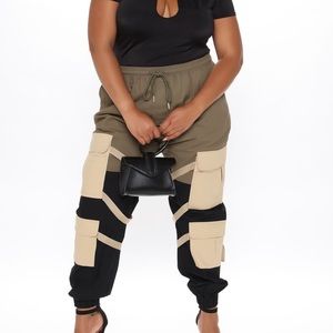 Fashion Nova cargo pants. 
Size 1X New, with tags, olive, black & tan